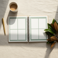 Open printable wedding day timeline planner on cream linen tablecloth with magnolia sprig and brass pen